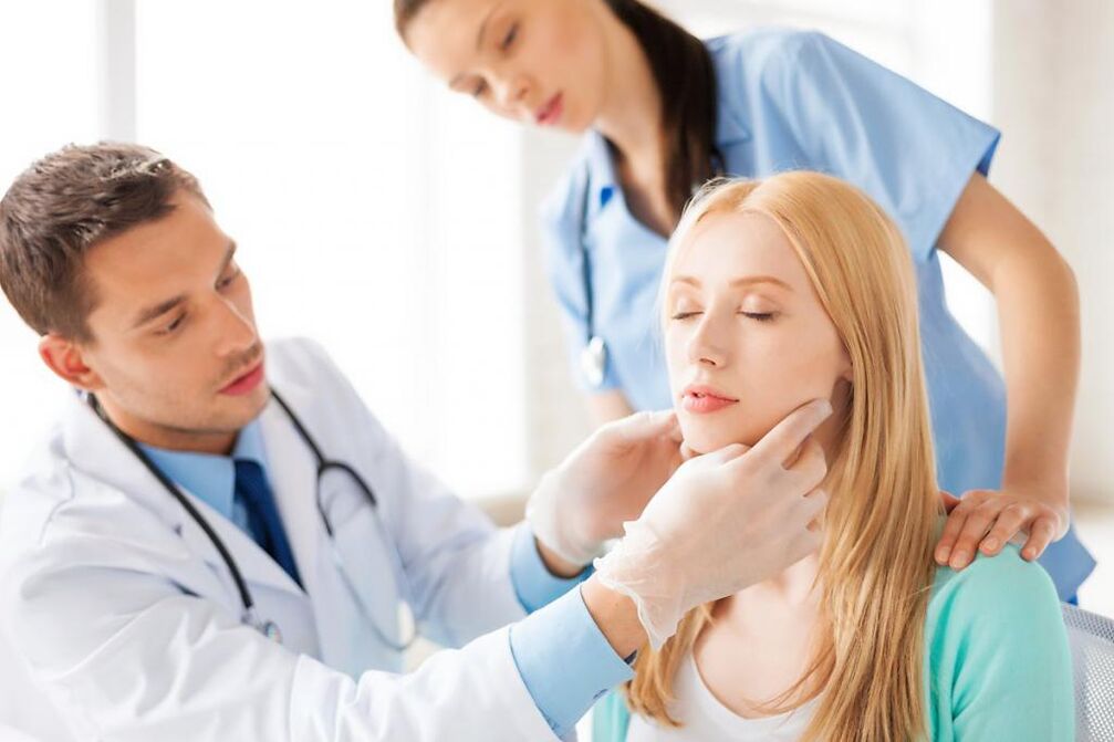 Doctor examines a patient with papilloma